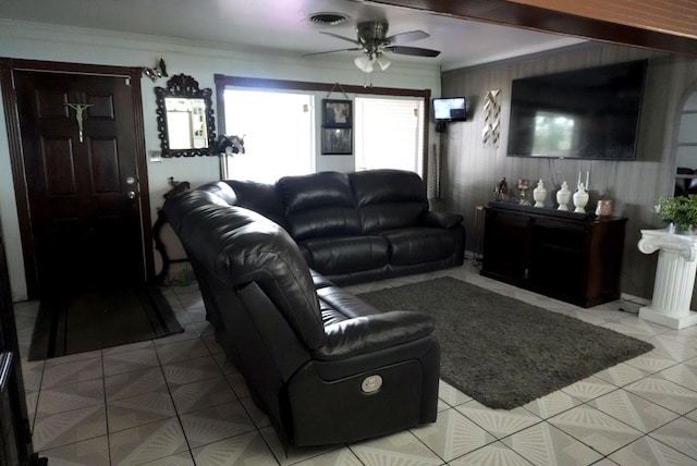 8606 S Friendship Rd, Houston, TX 77080 - living area with a ceiling fan, crown molding, light tile patterned floors, and wooden walls