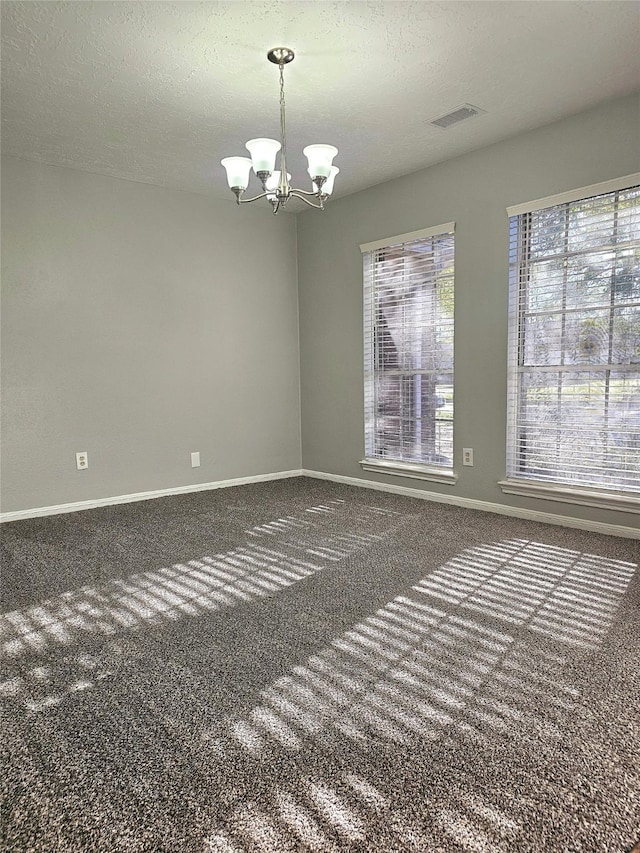 7715 Lobera Dr, Houston, TX 77083 - carpeted spare room with baseboards and a chandelier