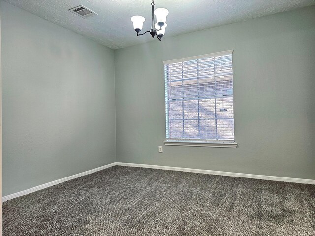 7715 Lobera Dr, Houston, TX 77083 - carpeted empty room featuring a chandelier and a textured ceiling