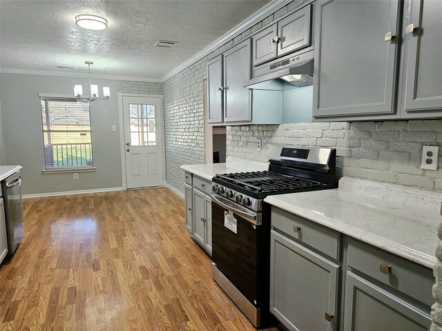 7715 Lobera Dr, Houston, TX 77083 - kitchen with stainless steel appliances, gray cabinetry, ornamental molding, under cabinet range hood, and a chandelier