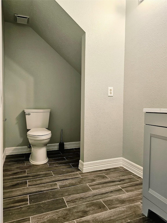 7715 Lobera Dr, Houston, TX 77083 - bathroom with wood finish floors and vaulted ceiling