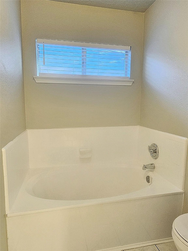 7715 Lobera Dr, Houston, TX 77083 - full bathroom featuring healthy amount of natural light and a bath