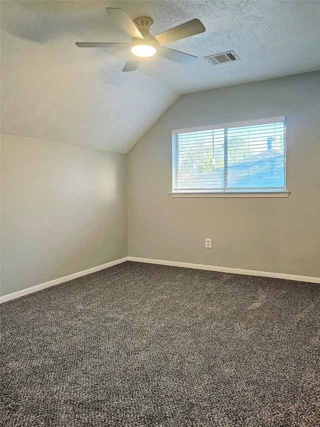 7715 Lobera Dr, Houston, TX 77083 - bonus room featuring a textured ceiling, vaulted ceiling, ceiling fan, and carpet flooring