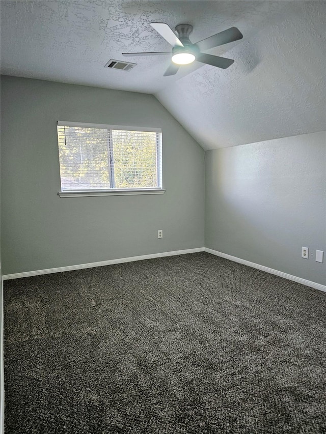 7715 Lobera Dr, Houston, TX 77083 - bonus room featuring vaulted ceiling, a textured ceiling, ceiling fan, and carpet