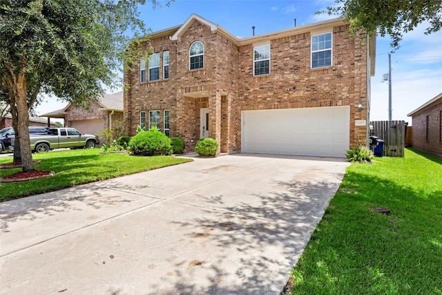 6605 Fallen Breeze Ln, Dickinson, TX 77539 - traditional-style home with a garage, concrete driveway, a front lawn, and brick siding