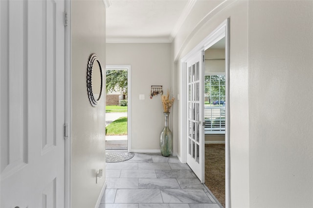 6605 Fallen Breeze Ln, Dickinson, TX 77539 - foyer with light marble finish floors and crown molding
