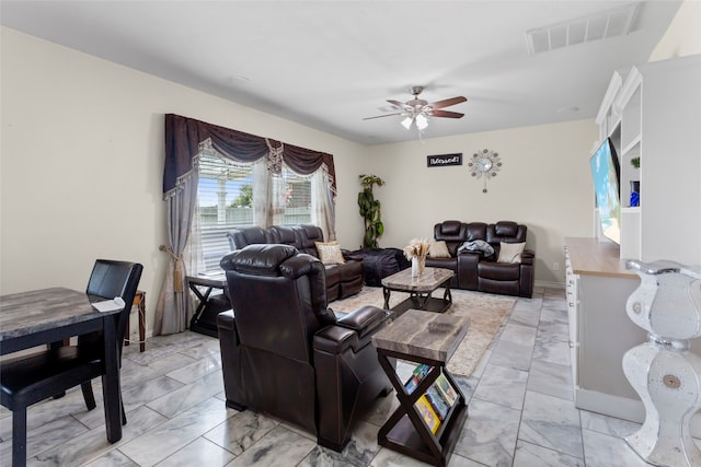 6605 Fallen Breeze Ln, Dickinson, TX 77539 - living room with light marble finish floors and a ceiling fan