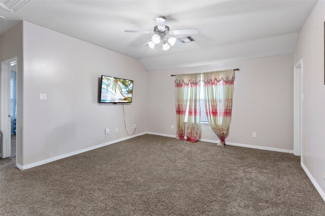 6605 Fallen Breeze Ln, Dickinson, TX 77539 - empty room with ceiling fan, carpet, and lofted ceiling