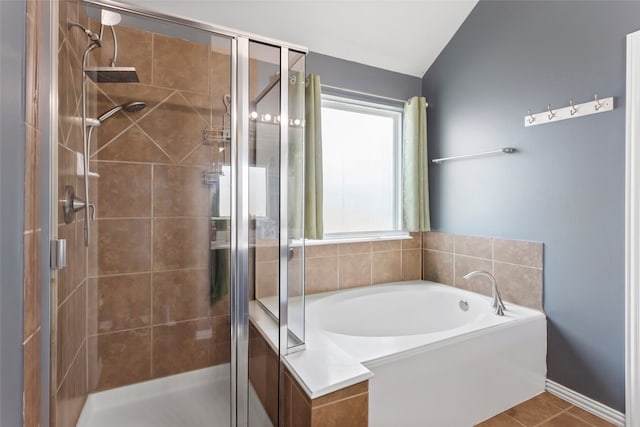 6605 Fallen Breeze Ln, Dickinson, TX 77539 - full bath with a stall shower, a bath, lofted ceiling, and tile patterned flooring