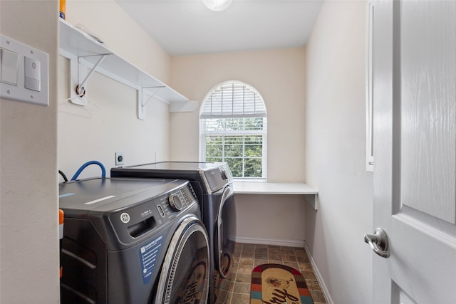 6605 Fallen Breeze Ln, Dickinson, TX 77539 - washroom featuring washing machine and clothes dryer and baseboards