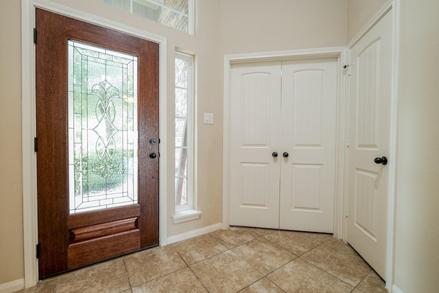 9335 Mystic Falls Ln, Humble, TX 77396 - entrance foyer featuring plenty of natural light and light tile patterned floors