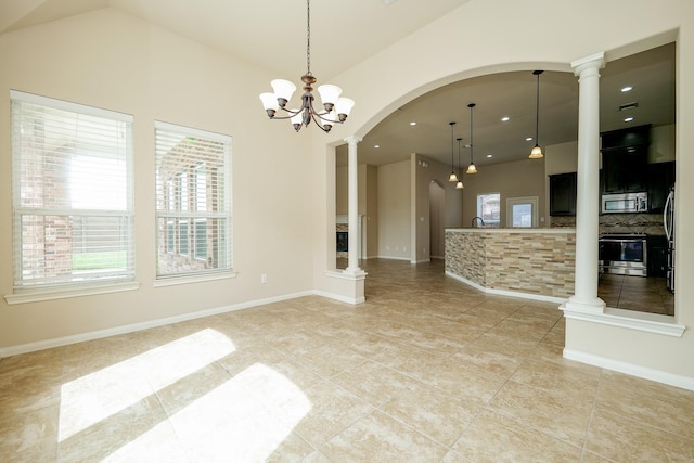 9335 Mystic Falls Ln, Humble, TX 77396 - unfurnished living room featuring decorative columns, light tile patterned floors, recessed lighting, lofted ceiling, and arched walkways