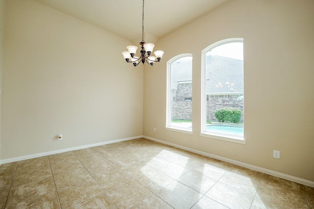 9335 Mystic Falls Ln, Humble, TX 77396 - tiled empty room featuring a chandelier and vaulted ceiling