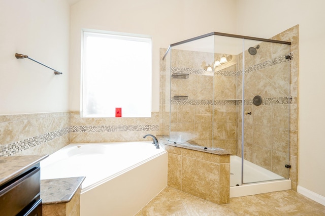 9335 Mystic Falls Ln, Humble, TX 77396 - bathroom with a garden tub, a shower stall, tile patterned flooring, and vanity