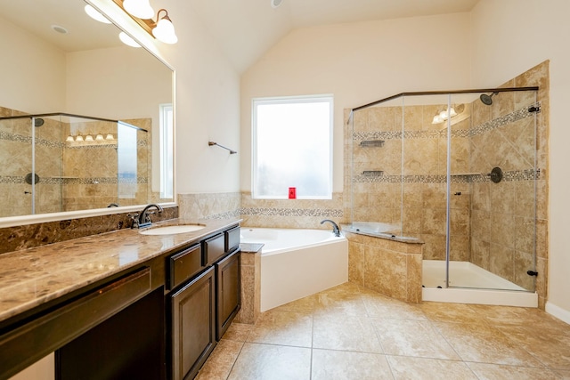 9335 Mystic Falls Ln, Humble, TX 77396 - full bath with a bath, healthy amount of natural light, vanity, a shower stall, and vaulted ceiling