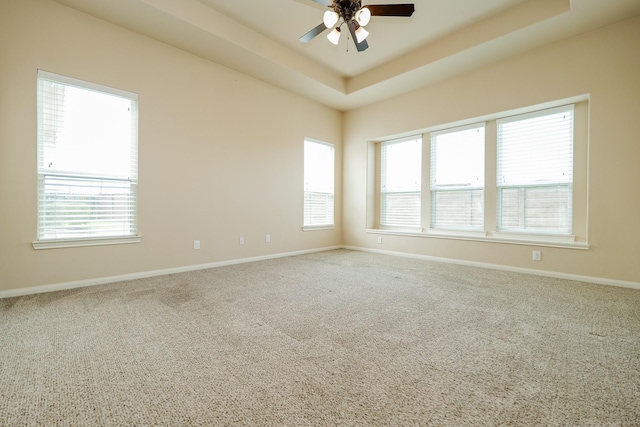 9335 Mystic Falls Ln, Humble, TX 77396 - carpeted empty room featuring ceiling fan and a raised ceiling