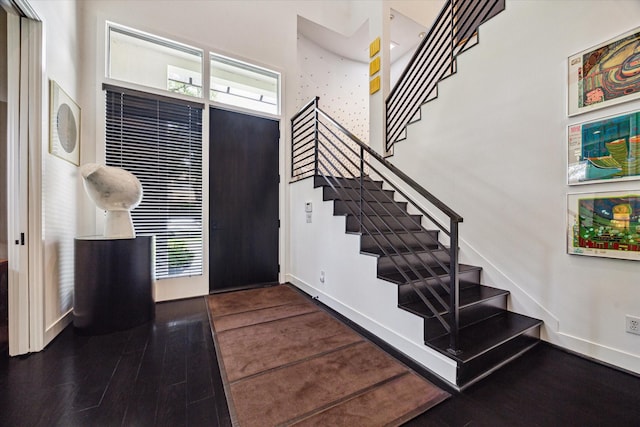 2409 Maconda Ln, Houston, TX 77027 - foyer entrance featuring stairs, wood finished floors, and a high ceiling