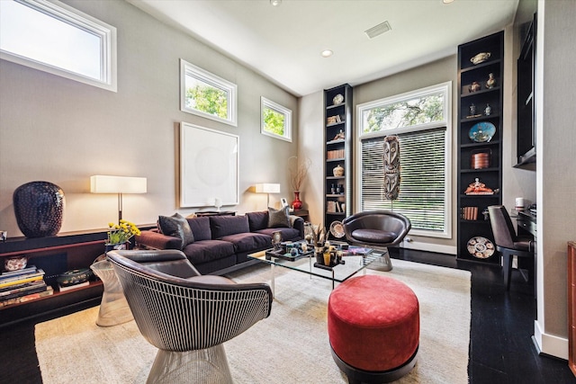 2409 Maconda Ln, Houston, TX 77027 - living area featuring built in shelves, recessed lighting, wood finished floors, and a desk