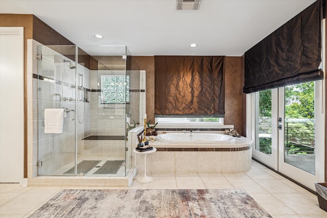 2409 Maconda Ln, Houston, TX 77027 - bathroom with a bath, healthy amount of natural light, tile patterned flooring, and recessed lighting