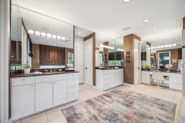 2409 Maconda Ln, Houston, TX 77027 - full bath with tile patterned flooring, two vanities, and recessed lighting