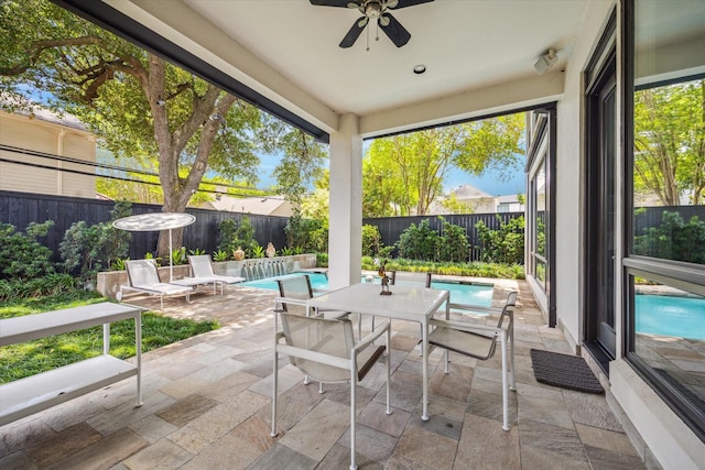 2409 Maconda Ln, Houston, TX 77027 - fenced backyard with a patio, ceiling fan, and outdoor dining area