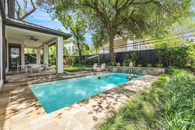 2409 Maconda Ln, Houston, TX 77027 - view of swimming pool featuring ceiling fan, a patio area, a fenced backyard, and outdoor dining area