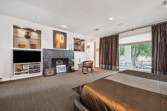2409 Maconda Ln, Houston, TX 77027 - bedroom with carpet floors, a fireplace, and recessed lighting