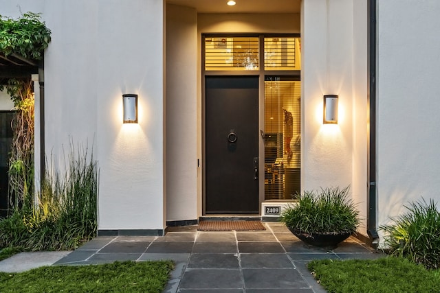 2409 Maconda Ln, Houston, TX 77027 - doorway to property with stucco siding