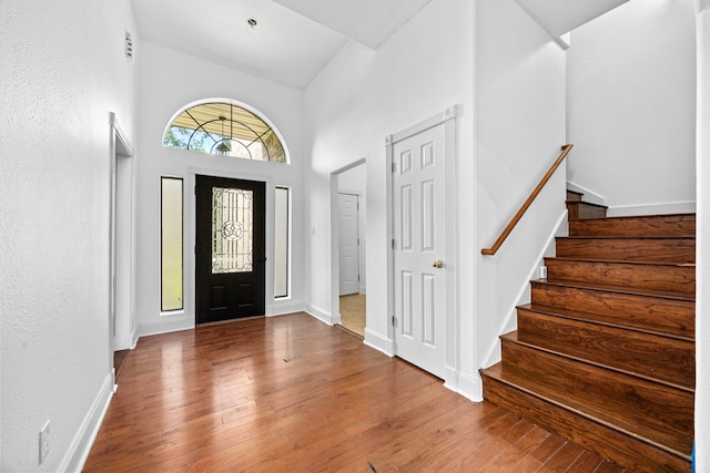 15810 Juneau Ln, Jersey Village, TX 77040 - foyer featuring hardwood / wood-style floors, stairway, and a high ceiling