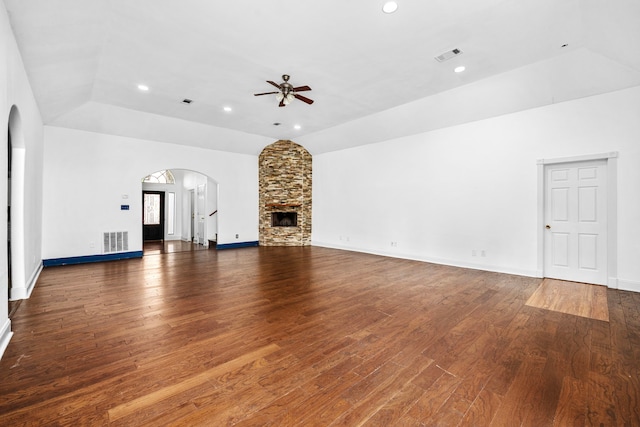15810 Juneau Ln, Jersey Village, TX 77040 - unfurnished living room with arched walkways, ceiling fan, vaulted ceiling, wood finished floors, and recessed lighting