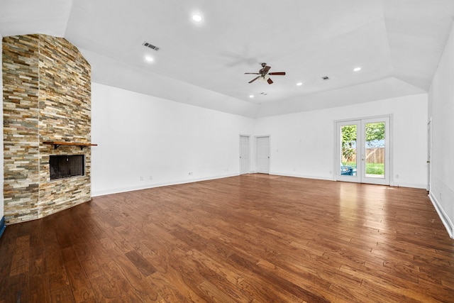 15810 Juneau Ln, Jersey Village, TX 77040 - unfurnished living room with ceiling fan, vaulted ceiling, hardwood / wood-style floors, a fireplace, and recessed lighting