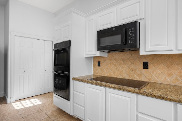 15810 Juneau Ln, Jersey Village, TX 77040 - kitchen with black appliances, backsplash, and white cabinetry