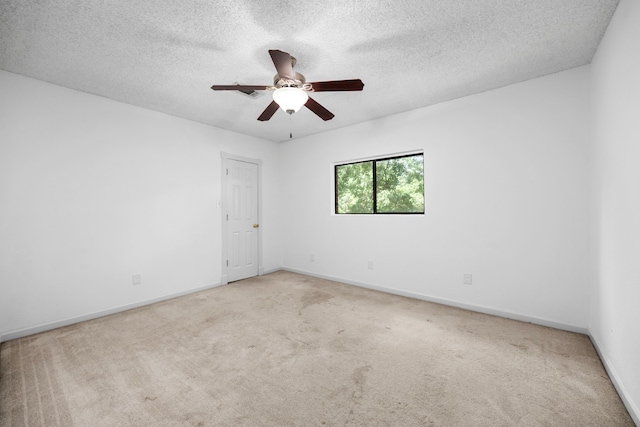 15810 Juneau Ln, Jersey Village, TX 77040 - carpeted spare room featuring a ceiling fan and a textured ceiling