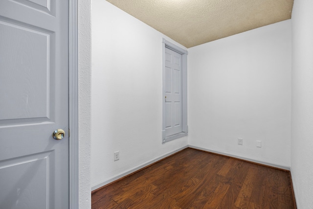 15810 Juneau Ln, Jersey Village, TX 77040 - empty room featuring dark wood-style floors and a textured ceiling