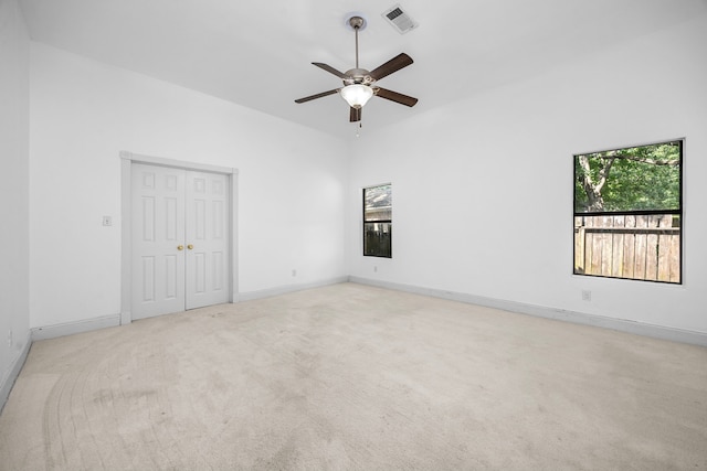 15810 Juneau Ln, Jersey Village, TX 77040 - unfurnished bedroom with light carpet, a closet, and a ceiling fan