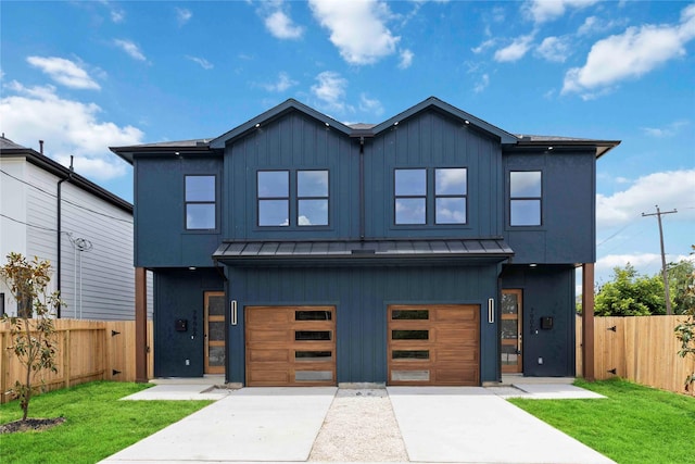 7906 Brandon St, Houston, TX 77051 - contemporary home with a standing seam roof, concrete driveway, an attached garage, and a metal roof