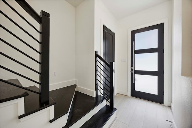7906 Brandon St, Houston, TX 77051 - foyer with stairway and light wood finished floors