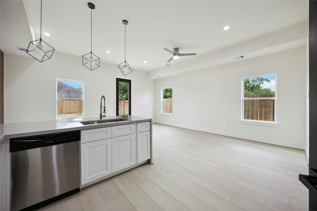 7906 Brandon St, Houston, TX 77051 - kitchen with dishwasher, white cabinets, plenty of natural light, open floor plan, and recessed lighting