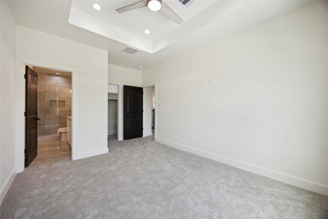 7906 Brandon St, Houston, TX 77051 - unfurnished bedroom featuring carpet flooring, a spacious closet, ensuite bath, a raised ceiling, and a closet