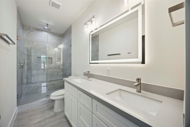 7906 Brandon St, Houston, TX 77051 - bathroom with double vanity, a stall shower, and wood finished floors