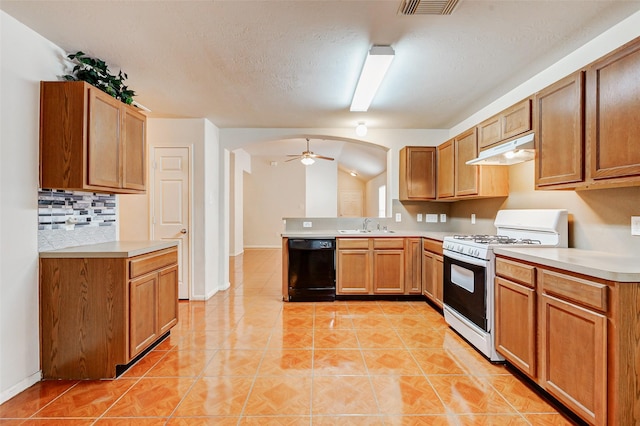 14006 Marners Ct, Houston, TX 77014 - kitchen with gas range gas stove, black dishwasher, under cabinet range hood, a ceiling fan, and light countertops
