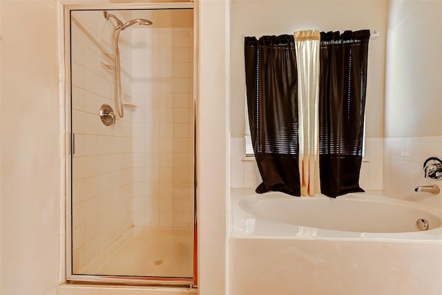 14006 Marners Ct, Houston, TX 77014 - bathroom with a stall shower and a garden tub