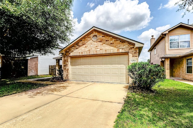 14006 Marners Ct, Houston, TX 77014 - view of front of house with a garage, stone siding, an outbuilding, driveway, and brick siding