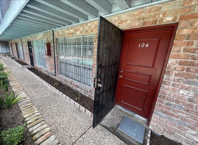 5617 Bissonnet St Unit 104, Houston, TX 77081 - property entrance featuring brick siding