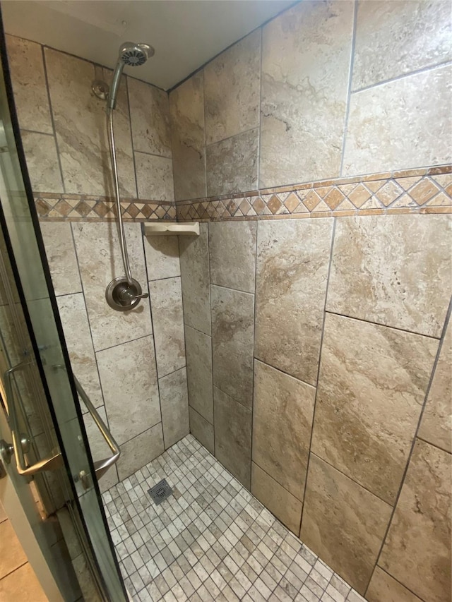 6300 Seawall Blvd Unit 9109, Galveston, TX 77551 - bathroom with a shower stall and tile patterned floors