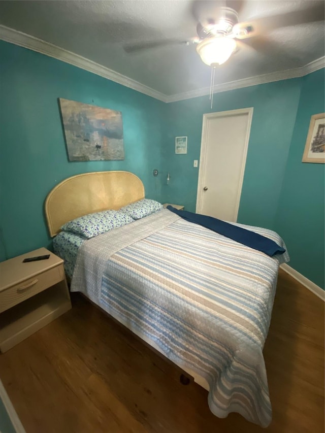 6300 Seawall Blvd Unit 9109, Galveston, TX 77551 - bedroom featuring dark wood-type flooring, crown molding, and ceiling fan