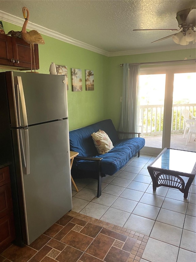 6300 Seawall Blvd Unit 9109, Galveston, TX 77551 - living area featuring ornamental molding, a textured ceiling, and a ceiling fan
