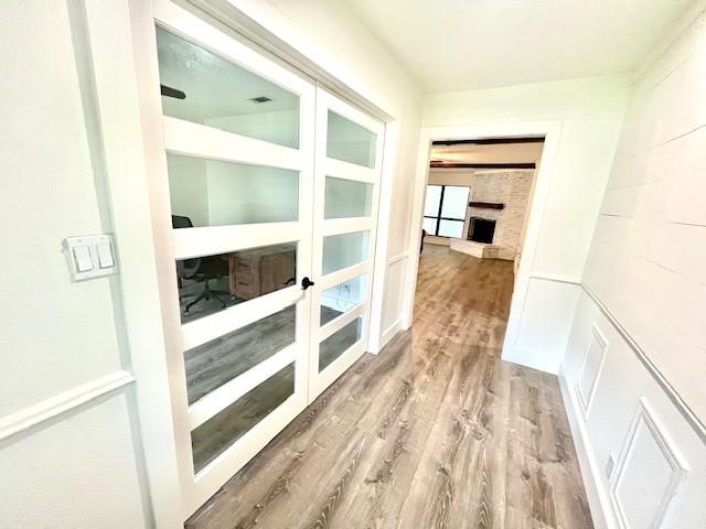 29019 Elmwood Dr, Shenandoah, TX 77381 - hall featuring wood finished floors and french doors
