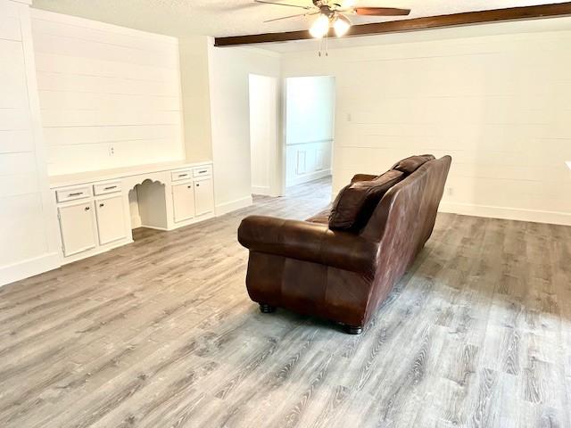 29019 Elmwood Dr, Shenandoah, TX 77381 - living area with a ceiling fan and light wood-style flooring