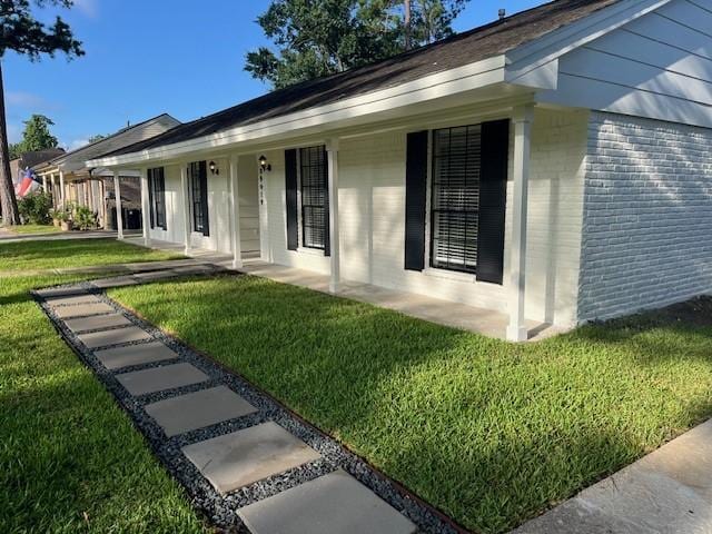 29019 Elmwood Dr, Shenandoah, TX 77381 - single story home featuring a front yard, brick siding, and a porch